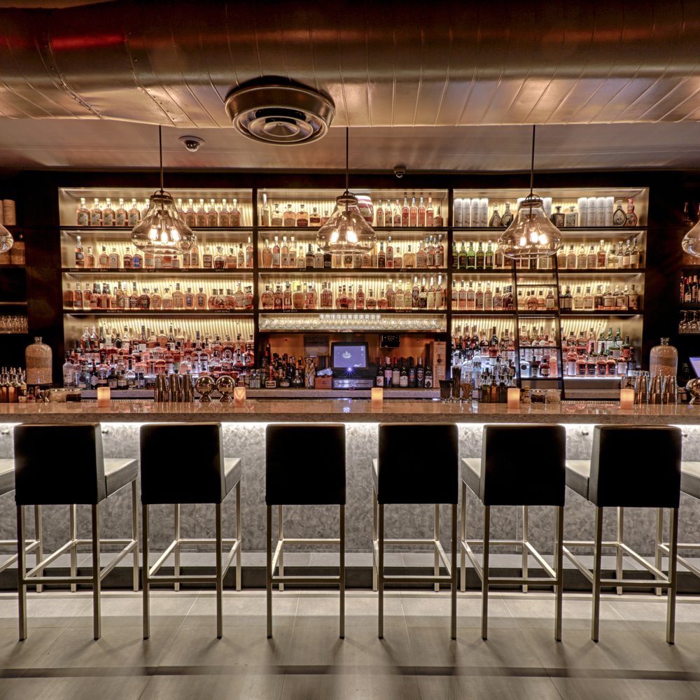 Sophisticated bar ambiance with mood lighting and elegant seating